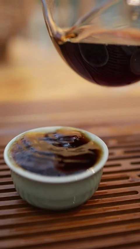 Tea Ceremony Close-Up: Pouring Hot Tea Into Cup Stock Footage 323918718