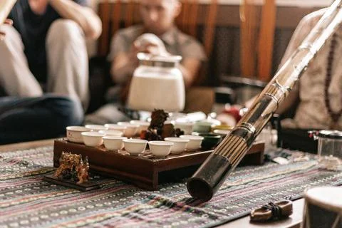The tea ceremony is conducted by a tea master. tea party in the style of boho Stock Photos