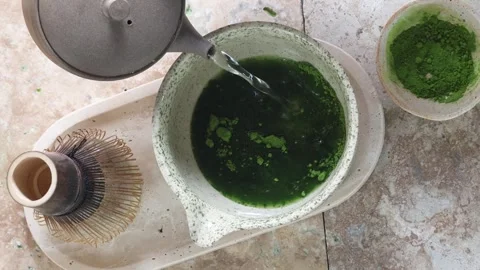 Tea Ceremony Essence. A serene matcha tea setup with traditional tools Stock Footage 320561604