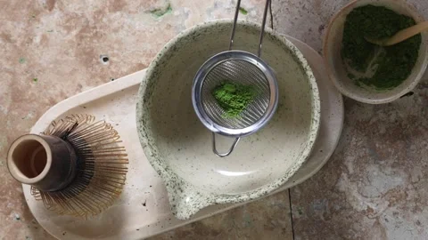 Tea Ceremony Essence. A serene matcha tea setup with traditional tools Stock Footage 320561658