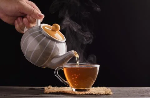 Tea ceremony process Tea ceremony A freshly brewed cup of black tea is placed Stock Photos
