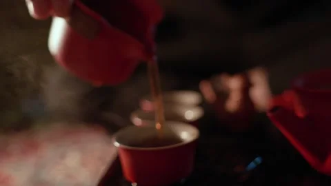 Tea Ceremony Ritual: Pouring Tea into Several Teacups Stock Footage 321933345