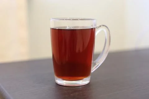 Tea in a clear mug on the table 写真素材