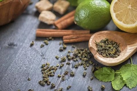Tea composition with cinnamon sticks, lemons Stock Photos