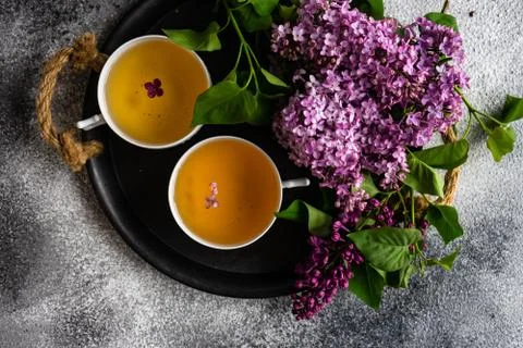 Tea concept with lilac Stock-Fotos