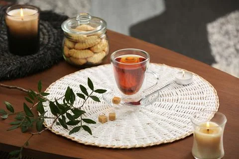 Tea, cookies and decorative elements on wooden table indoors Stock Photos