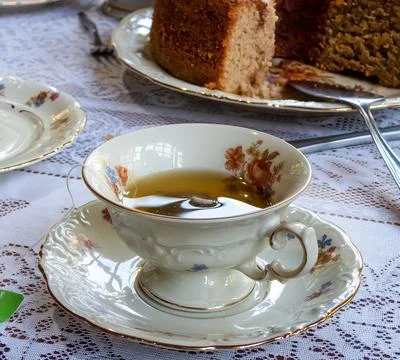 Tea cup and cake Stock Photos