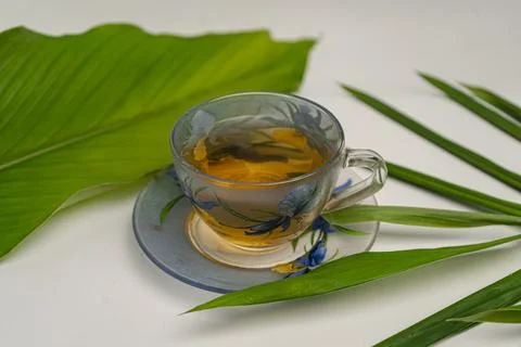 Tea cup and leafs Stock Photos