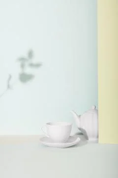 Tea cup and teapot on the table. Stock Photos