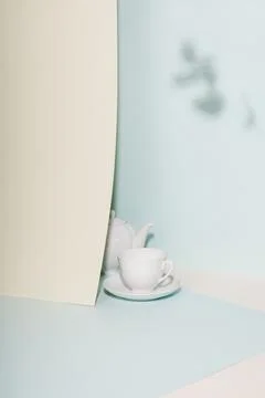 Tea cup and teapot on the table. Stock Photos