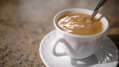 Tea in cup being stirred (slowmo) Stock Footage 162690892