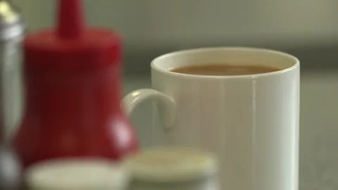 Tea Cup Close‑Up Tracking Shot in Cafe Beverage &amp; Lifestyle Stock Footage Stock Footage 145978936