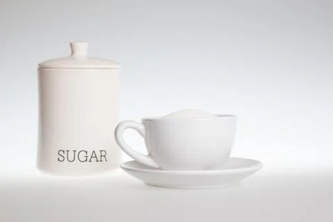 Tea cup full of sugar Stock Photos