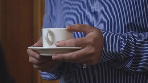 Tea cup in hands man Stock Footage