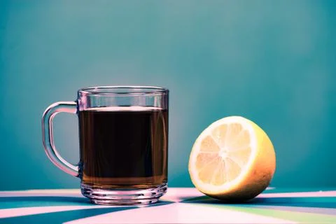 Tea in cup with lemon isolated on white background Stock Photos