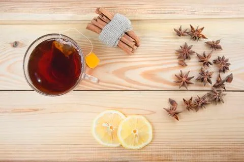 Tea cup with lemon on a wooden table Stock Photos