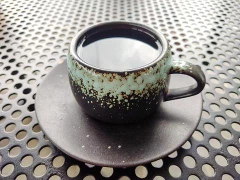 Tea Cup on Metal Surface Stock Photos