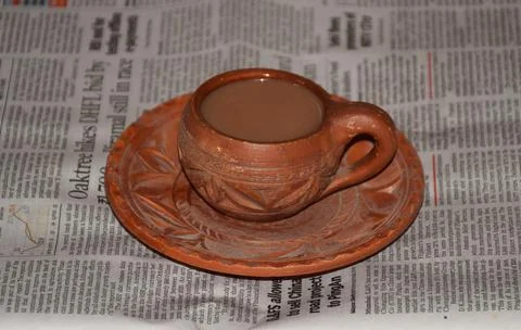 Tea cup on newspaper Stockfoto's