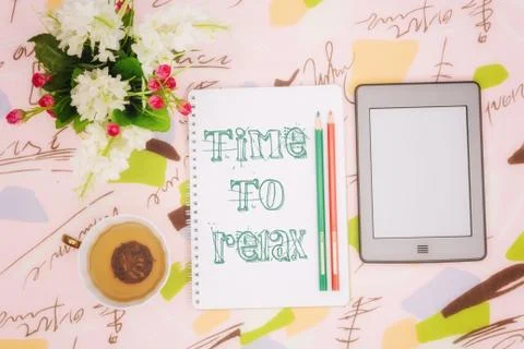 Tea cup, notebook and ebook Stock Photos
