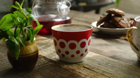 Tea cup with red and white polka dots on table. Stock Footage 310545528