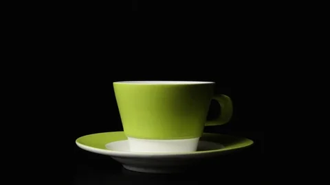 In a tea cup sugar falls super slow motion Video stock 72863174