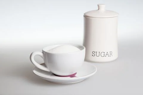 Tea cup with sugar Stock Photos