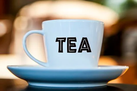 Tea cup on a table with bokeh background Stock Photos