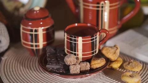 Tea, Cup, teapot, chocolate bar, cane sugar, cozy house Stock Footage 134887248