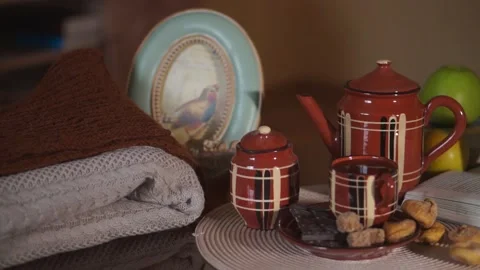 Tea, Cup, teapot, chocolate bar, cane sugar, cozy house Stock Footage 134887252