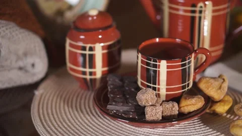 Tea, Cup, teapot, chocolate bar, cane sugar, cozy house Stock Footage 134887282