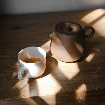 Tea cups with a ceramic teapot Stock Photos
