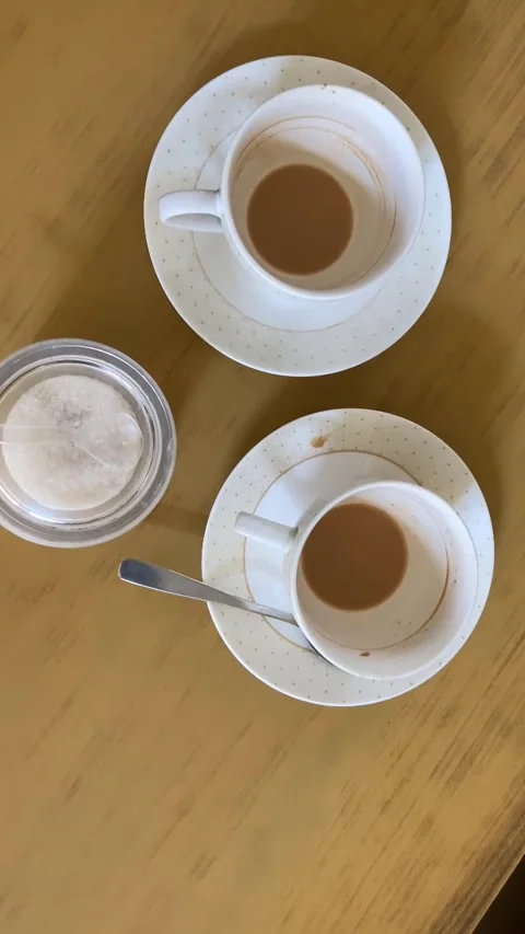 Tea cups with finished tea. A real time footage of cups with sugar pot Stock Footage 282818607