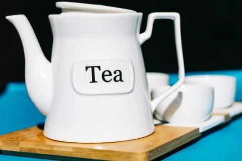 Tea cups set on blue background. Minimalist breakfast photo. Stock Photos