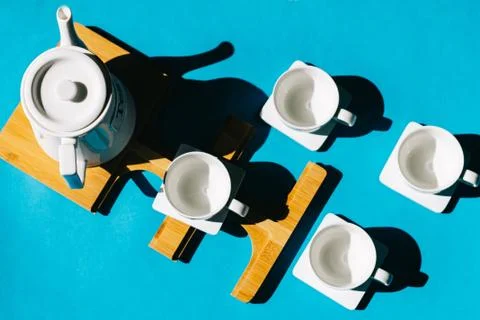 Tea cups set on blue background. Minimalist breakfast photo. Foto stock