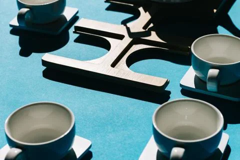 Tea cups set on blue background. Minimalist breakfast photo. Stock Photos