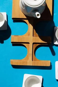 Tea cups set on blue background. Minimalist breakfast photo. Stock Photos