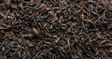 Tea dried leafs close up studio shot over rotating 스톡 동영상 324847098