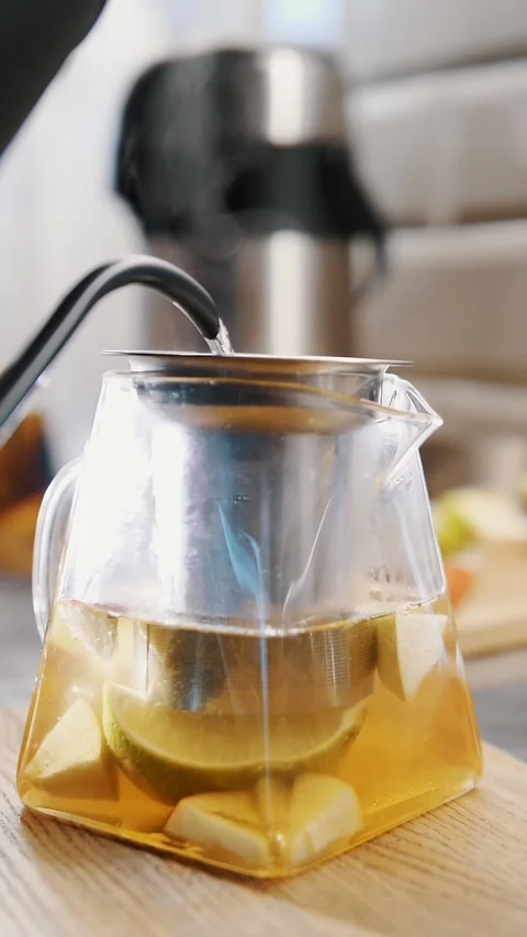 Tea drink. making tea. close-up. boiling water is poured into glass teapot with Stock Footage 323513299