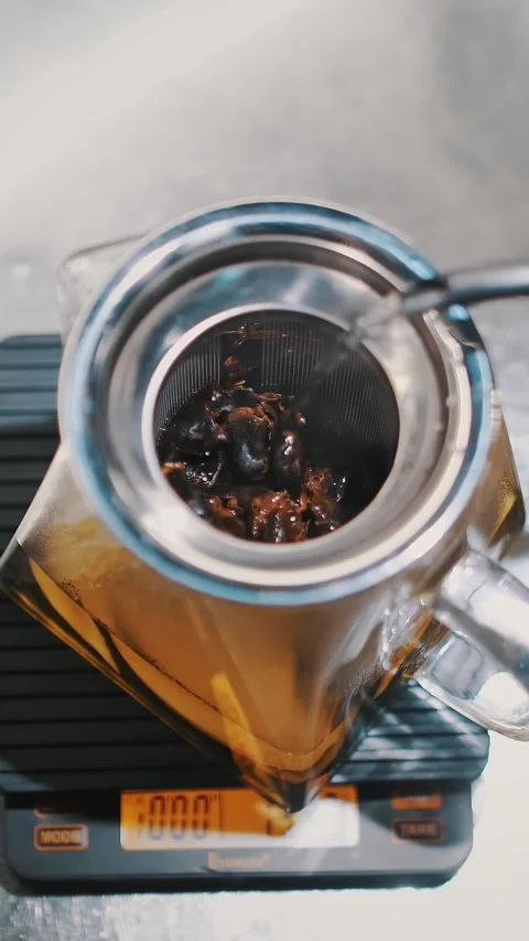 Tea drink. preparation of special tea. close-up. top view. tea master pours Stock Footage 323436605