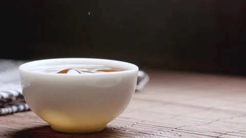 Tea dripping - a close-up of a cup of black tea Stock Footage 234501679