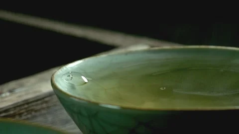 Tea dripping - tea and tea cup Stock Footage 234495912