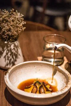 Tea Egg with Soubise , Mandarin pu-erh broth and Gingko Stock Photos