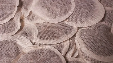 Tea filters rotating pattern macro texture background backdrop footage video. Stock Footage 91380479