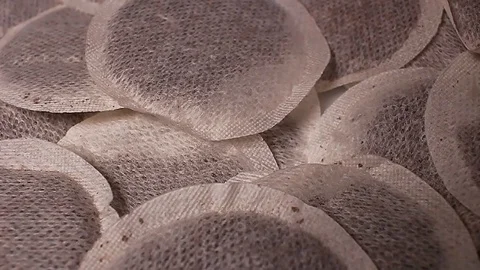 Tea filters rotating pattern macro texture background backdrop footage video. Stock Footage 91380583