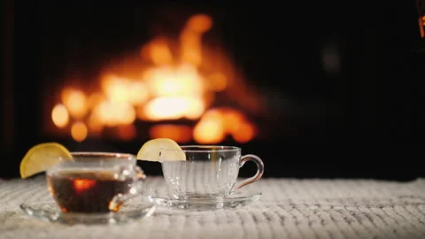 Tea by the fireplace, romantic evening concept Stock Footage 136227128