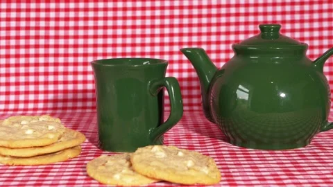 Tea with freshly baked biscuits on red background Stock Footage 163988169