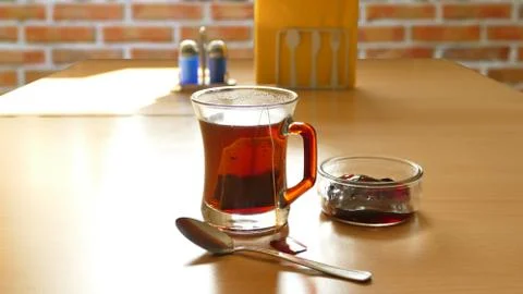 Tea in a glass on a brick background Stock Photos