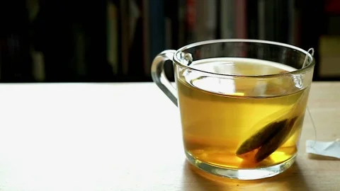 Tea in a glass cup on table Stock Footage 128648422