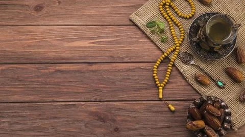 Tea glass with dates fruit beads canvas. High quality and resolution beautiful Stock Photos
