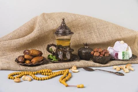 Tea glass with eastern sweets beads Stock Photos